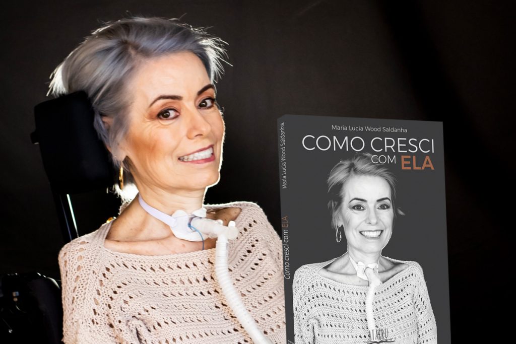 Foto de Maria Lucia e seu livro